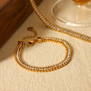 Elegant 18K gold plated stainless steel bracelet with double layered white zircon stones