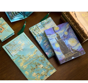Artistic fan-shaped book light and stationery notebooks featuring classic impressionist paintings