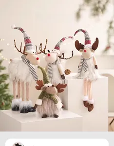 Detail of felt Christmas reindeer plush set with striped scarves and tall hats