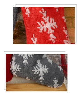 Detail of soft plush Christmas stockings in red and gray with white snowflake patterns