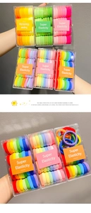 Detail of colorful high elasticity hair bands in a portable box for girls