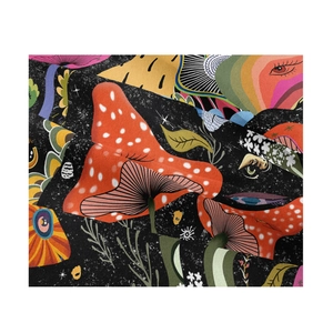 Close-up of mushroom and eye pattern detail on bohemian psychedelic tapestry fabric