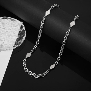 Titanium steel chain necklace with diamond-shaped star pendants on a reflective black base