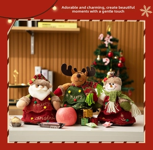 Detailed view of plush Christmas candy bags with Santa, reindeer, and snowman dolls