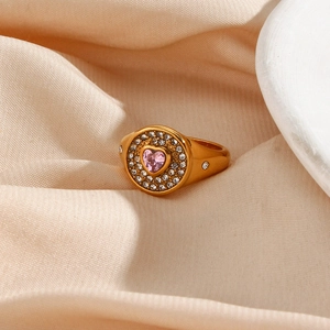 Close-up of 18K gold plated ring featuring a pink heart zircon and sparkling crystal halo