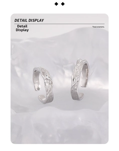 Macro detail of S925 silver couple rings featuring textured bark patterns and sparkling zircons