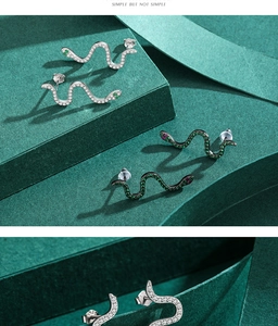 Detailed view of snake earrings with S925 silver hallmark and pavé cubic zirconia inlay