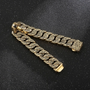 Macro shot of gold vintage engraved patterns on durable titanium steel chain links