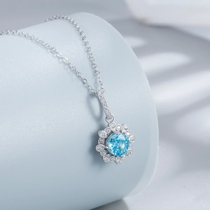 S925 sterling silver necklace with 6mm blue ice cut stone in a floral four-claw setting