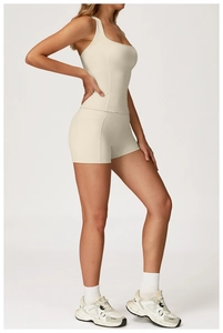 Close-up of beige yoga set showing high-elastic seamless fabric and racerback tank top
