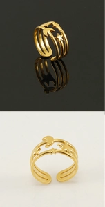 Detailed close-up of 18K gold stainless steel ring with moon and star hollow design