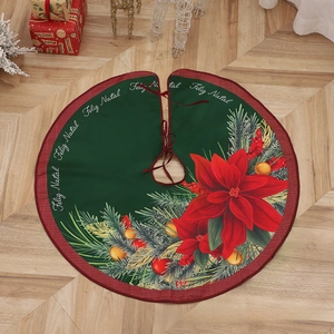 Close-up of green Christmas tree skirt with poinsettia prints and Feliz Natal text
