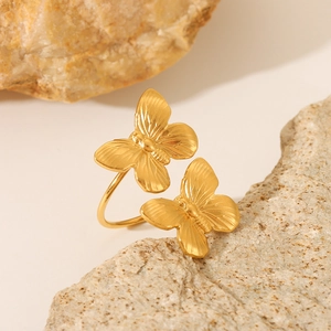 Golden butterfly open ring made of stainless steel with detailed textured wing patterns