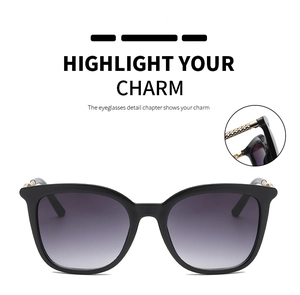Detail of hollow-out metal temples on vintage black frame gradient sunglasses