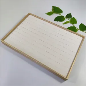 100-slot jewelry display tray with gold metal frame and white velvet padding