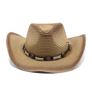 Close-up of woven straw texture and star metal accents on the gradient brown cowboy hat