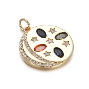 Detailed view of a gold circular pendant with celestial moon, stars, and colorful gems