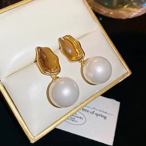 Elegant French style round pearl drop earrings with wrinkled gold metal finish