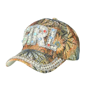 Women's floral baseball cap with rhinestone GIRL lettering and pearl-studded brim