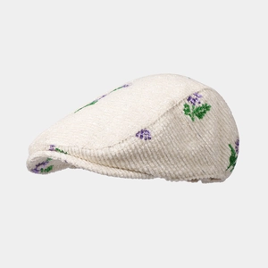 Detailed texture of corduroy beret with exquisite purple floral embroidery and sequins