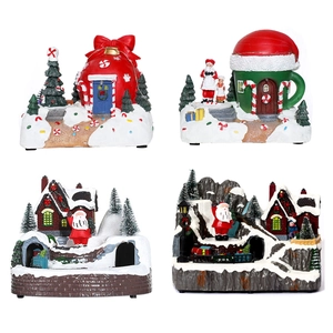Set of four revolving Christmas resin music boxes featuring Santa Claus and snow houses