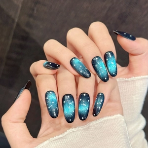 Deep starry blue gradient press-on nails with cat-eye glitter and white dot galaxy accents