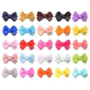 Detailed grid of 25 colors small handmade grosgrain ribbon hair clips for toddlers