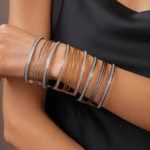 Multi-layered geometric metallic cuff bracelet set in gold silver and black tones