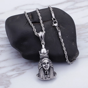 Close-up of vintage silver-tone Egyptian Pharaoh pendant on a twisted rope chain necklace