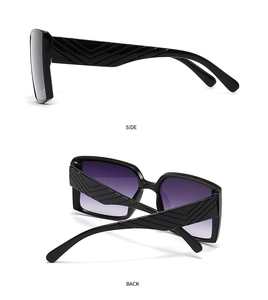 Detail view showing black square sunglasses with textured temples and purple gradient lenses