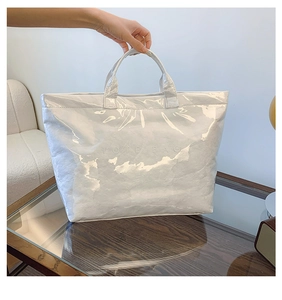 Detail of Tyvek tote bag featuring unique crinkled texture under transparent waterproof layer