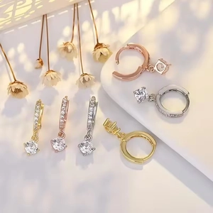 Elegant zircon hoop earrings in gold, rose gold, and silver finishes with crystal drops
