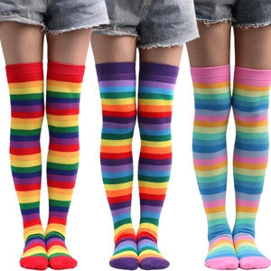 Vibrant rainbow striped over-the-knee cotton socks for festive parties and costumes.