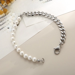 Detail of silver Cuban chain and white pearl spliced bracelet with a secure lobster clasp