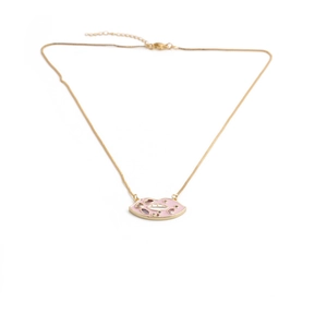Gold chain necklace with pink lips pendant set with colorful crystals on white background