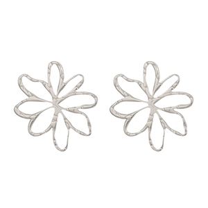 Close-up of hollow flower stud earrings in silver finish with a metallic texture