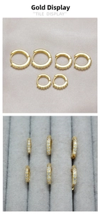 Detailed view of three sizes of gold-plated hoop earrings with micro-pave crystals
