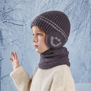 Winter kids knit hat and neck warmer set in dark purple with fleece lining in snow scene