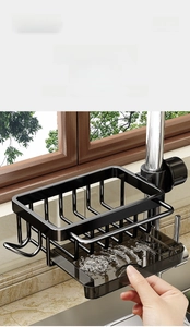 Detail of black metal faucet rack with removable drainage tray and side hooks