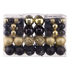 Detail of gold and black Christmas ball ornaments with glitter and hollow design in a box