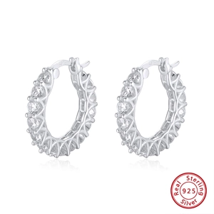 Macro detail of S925 sterling silver hoop earrings with micro-set white zircon stones
