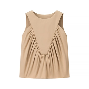 Detail of khaki sleeveless top showing elegant Y-shaped panel stitching and pleated texture