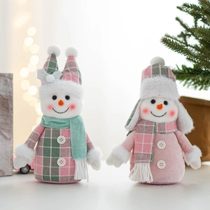 Detailed view of plush Christmas snowmen with knitted hats and scarves for festive decor
