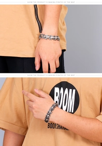 Macro detail of men's stainless steel dragon bone link bracelet with retro carvings