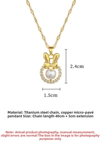 Macro shot of gold rabbit bow pendant with pearl and micro-inlaid zircon details