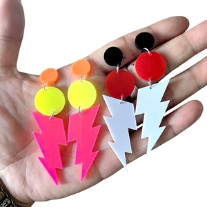 Neon acrylic lightning bolt dangle earrings in fluorescent yellow and retro pink colors