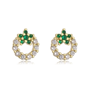 Detail of gold-plated earrings with green clover gemstones and white zircon pave setting