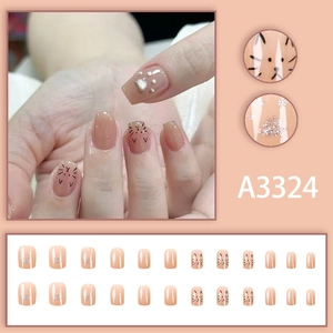 Cute cartoon cat design short press-on nails with nude pink base and silver glitter paw prints