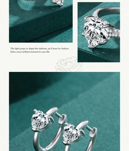 Macro detail of silver heart jewelry set featuring sparkling heart-shaped gemstones