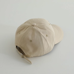 Detailed back view of khaki cotton baseball cap showing adjustable strap and metal buckle